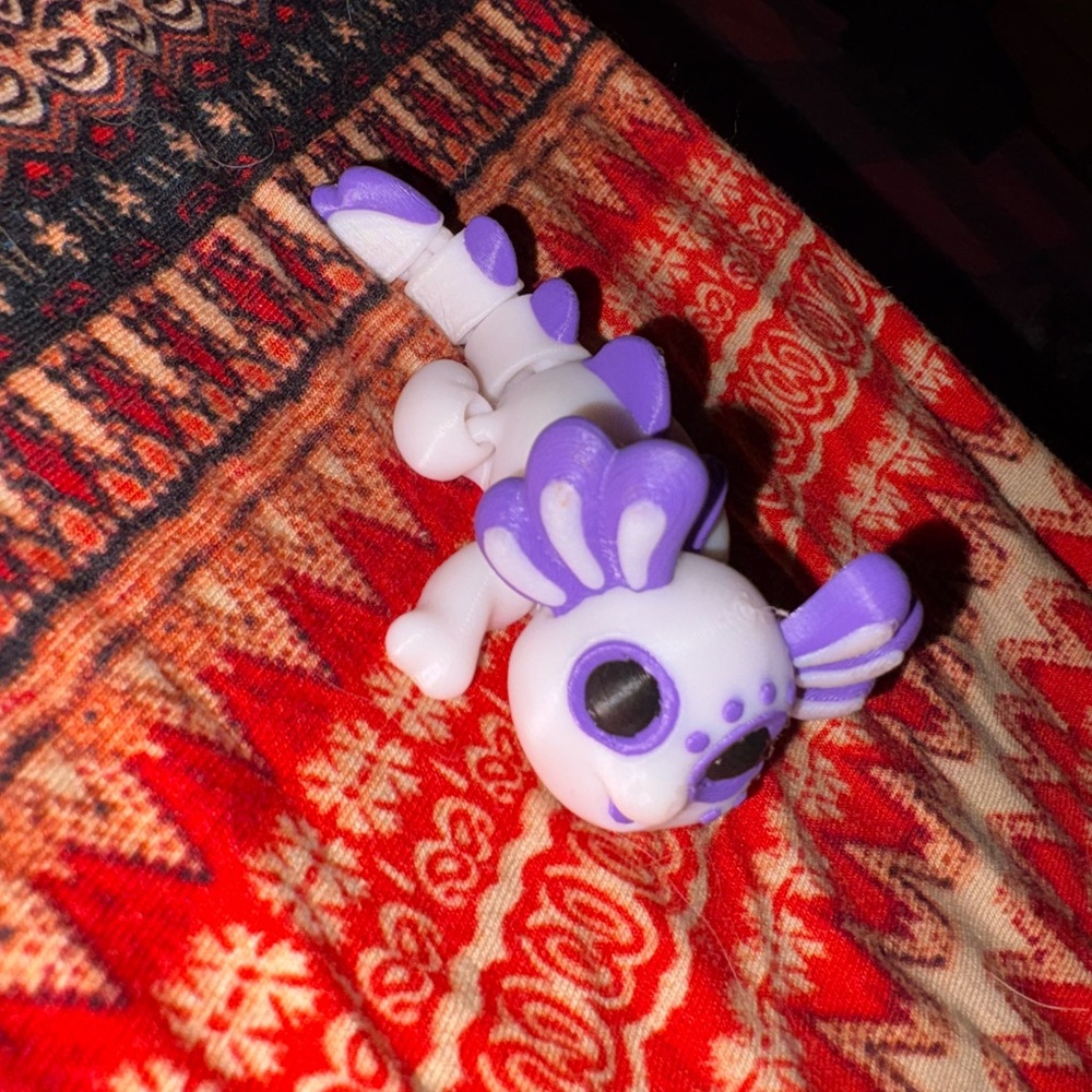 Purple and White Toy Figurine